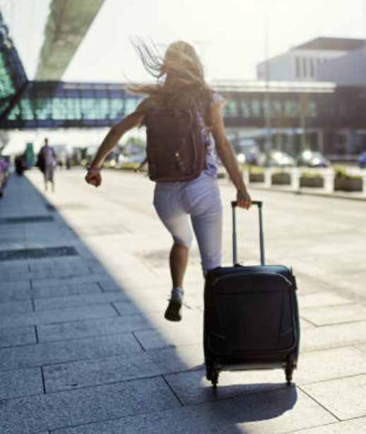 A photo of a girl running through an airport